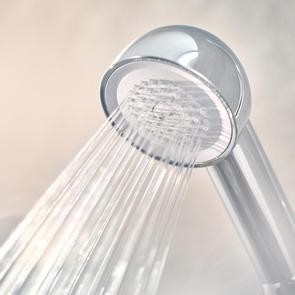 Hand holding Chrome Hand Shower Filter.