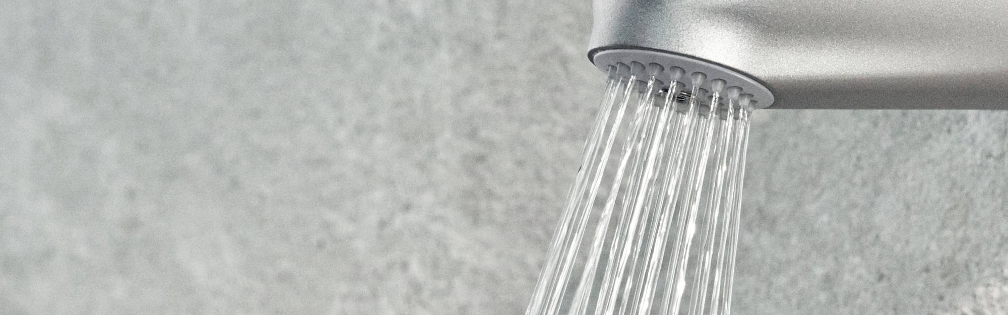 Close-up of the Flex Wall Shower Filter against a blurred background.