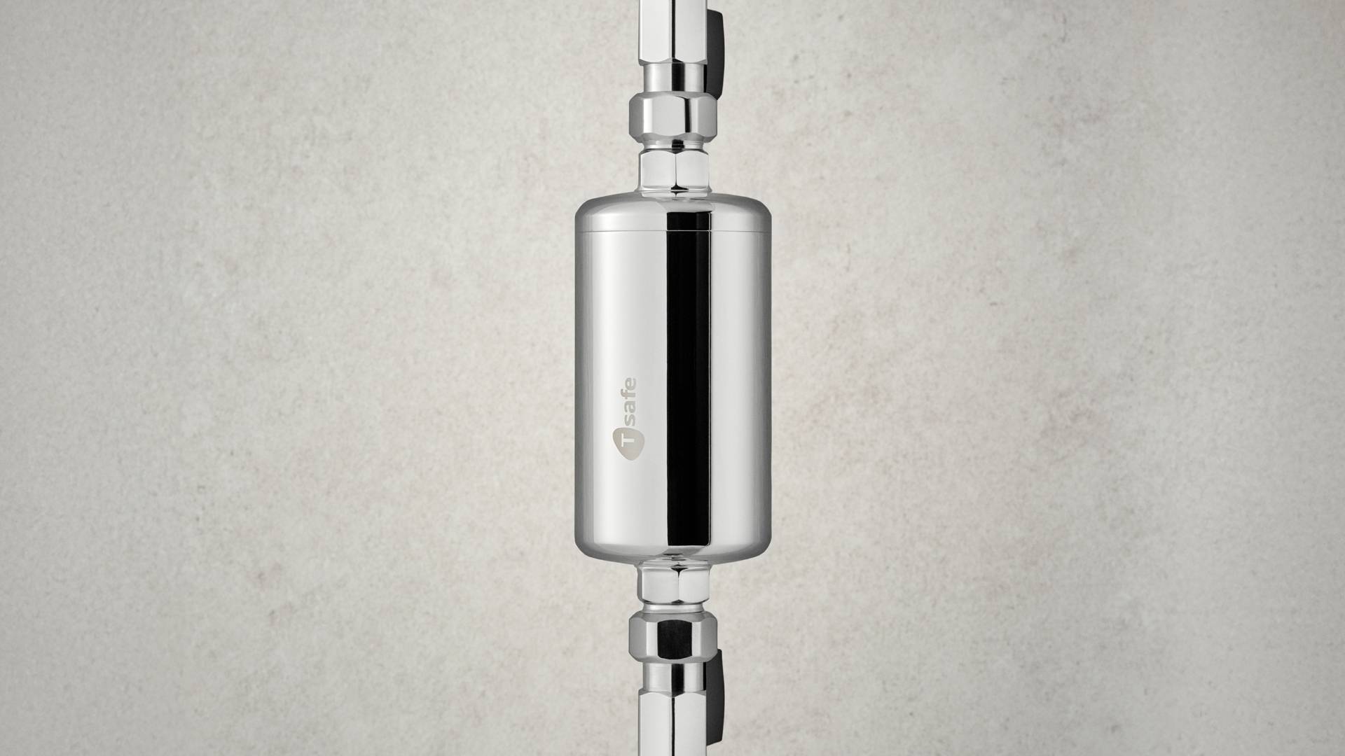 Close-up of a T-safe Chrome In-Line Filter installed in a water pipe, designed for preventing waterborne pathogens in healthcare water systems.